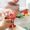 NOWY Glo Pals, Postać do kąpieli Sammy - zestaw z dwiema kostkami sensorycznymi świecącymi w wodzie