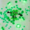 NOWY Glo Pals, Postać do kąpieli Pippa - zestaw z dwiema kostkami sensorycznymi świecącymi w wodzie